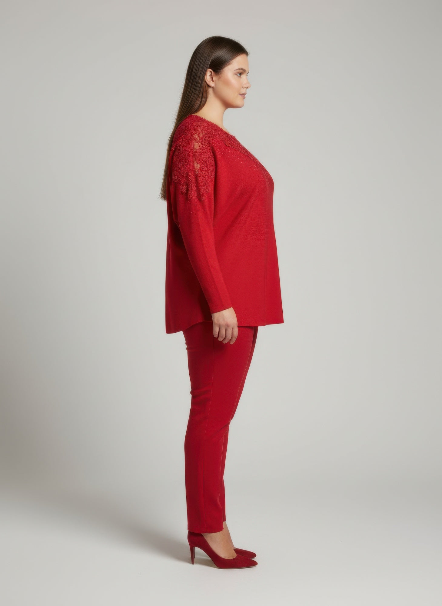 Red lace-embellished knit tunic top, three-quarter sleeves, side profile
