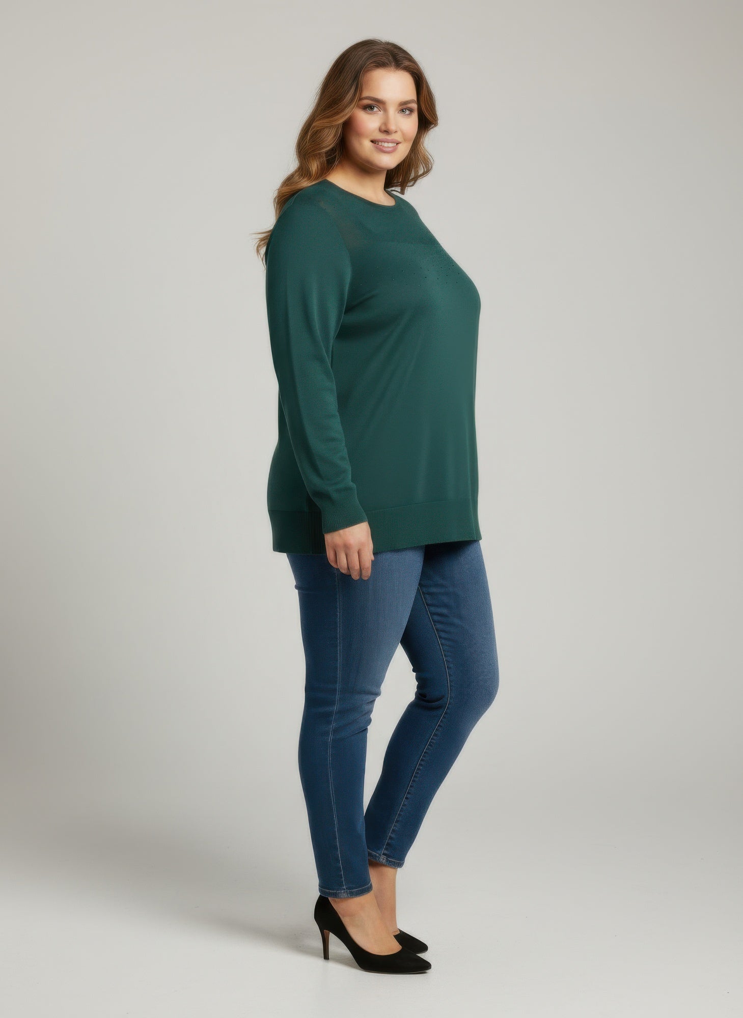 Green shimmer knit tunic top with long sleeves and round neck