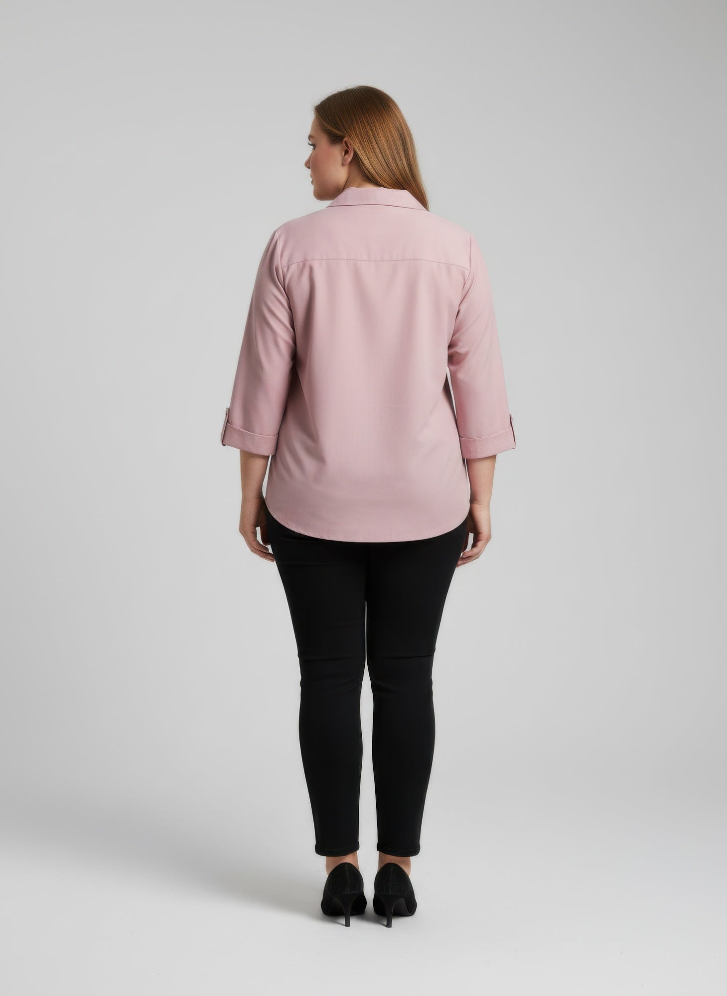 Blush pink button-front blouse with roll sleeves, back view