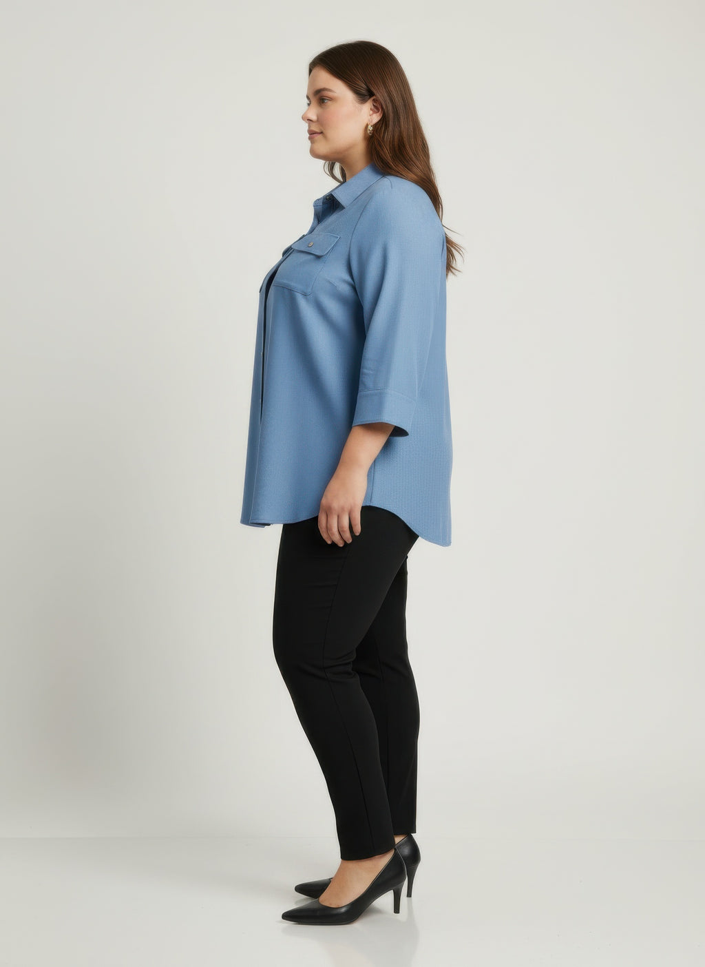 Blue utility button-front tunic shirt side view with button placket and chest pockets