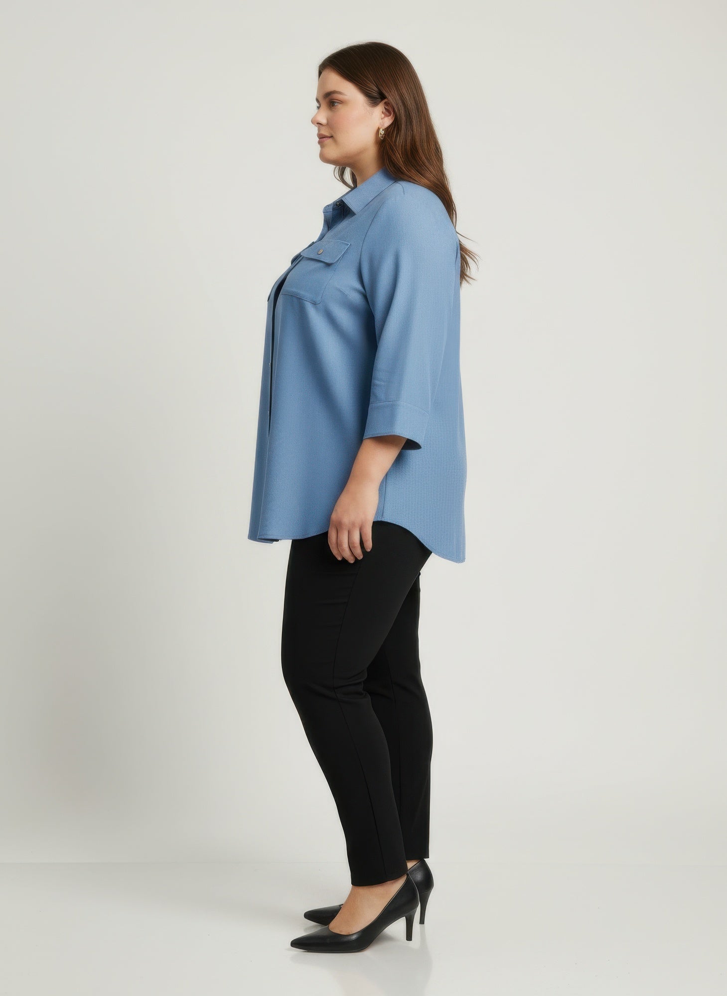 Blue utility button-front tunic shirt side view with button placket and chest pockets