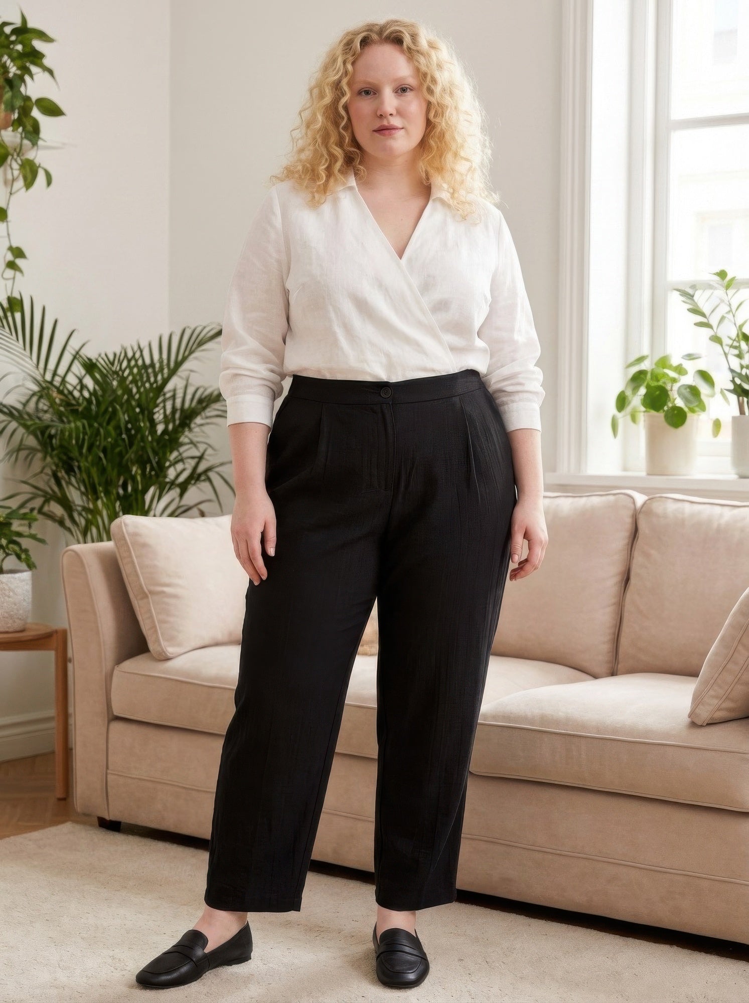 High-rise linen-blend straight-leg pants in black, front button closure, relaxed fit