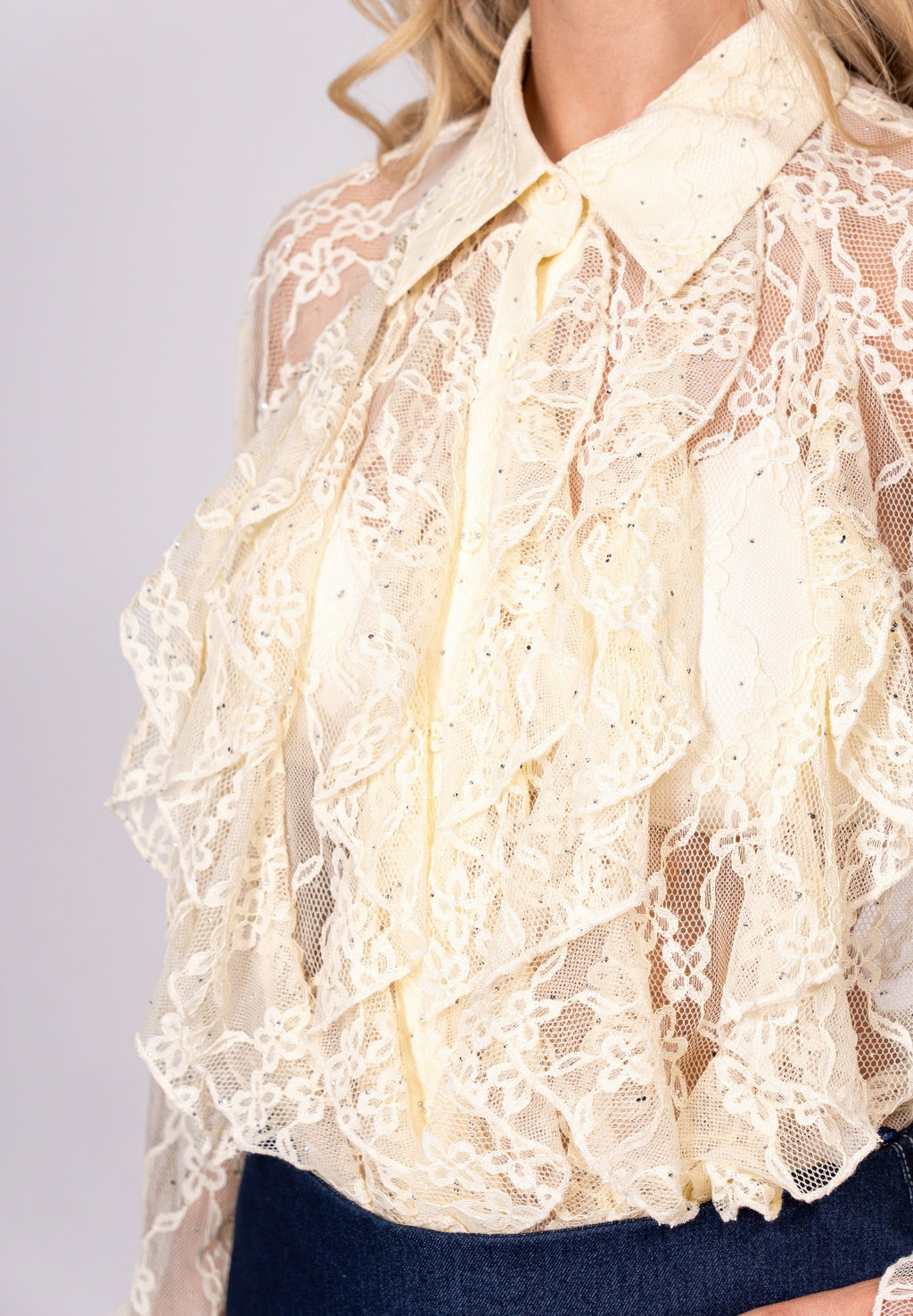 Ivory lace T-shirt close-up of floral lace texture and buttoned collar