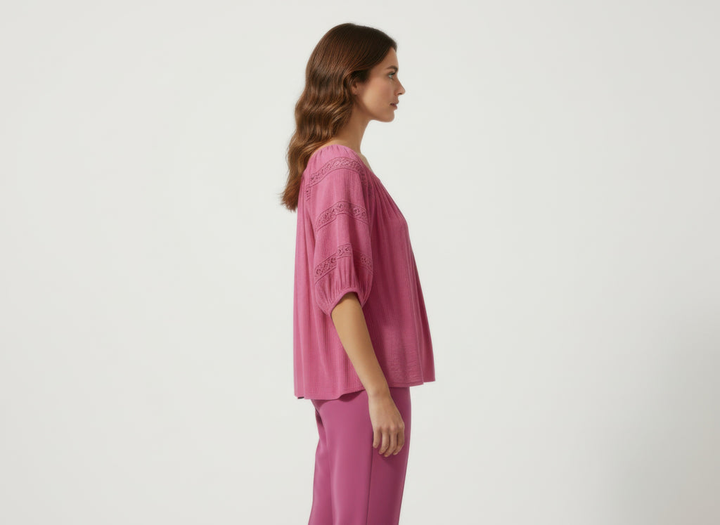 Unique Spectrum solid short sleeve blouse, pink side view with puff sleeves