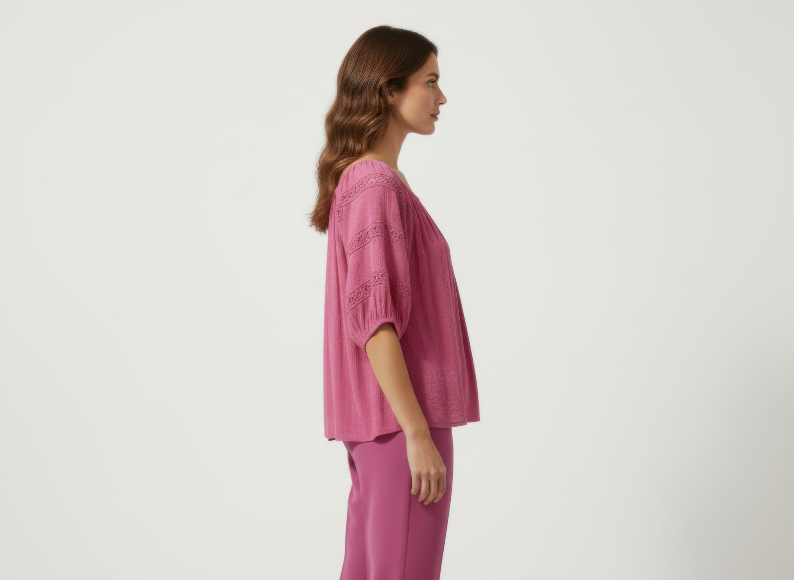 Unique Spectrum solid short sleeve blouse, pink side view with puff sleeves