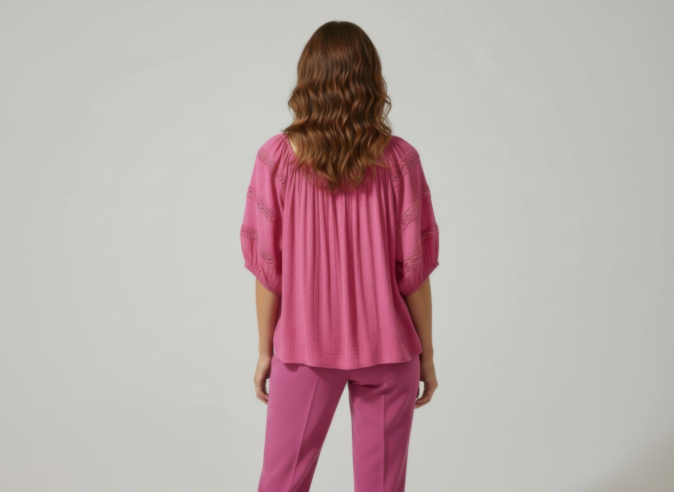 Unique Spectrum solid short sleeve blouse, pink back view with gathered shoulders