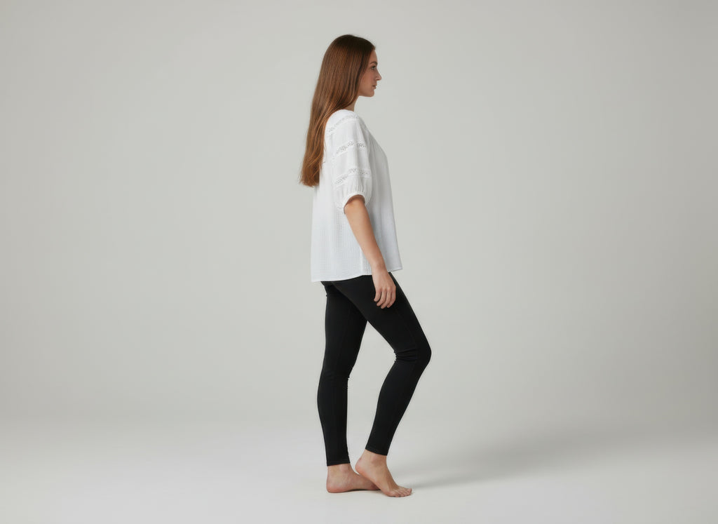 Unique Spectrum solid short sleeve blouse, white side view with lace-like sleeve embroidery