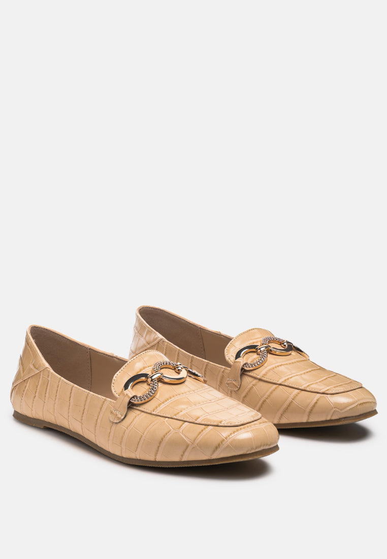 Beige croc-textured loafers angled view with chain detail on the vamp