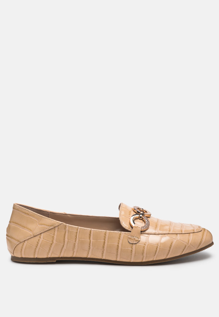Beige croc-textured metal-link loafers with chain hardware on the vamp