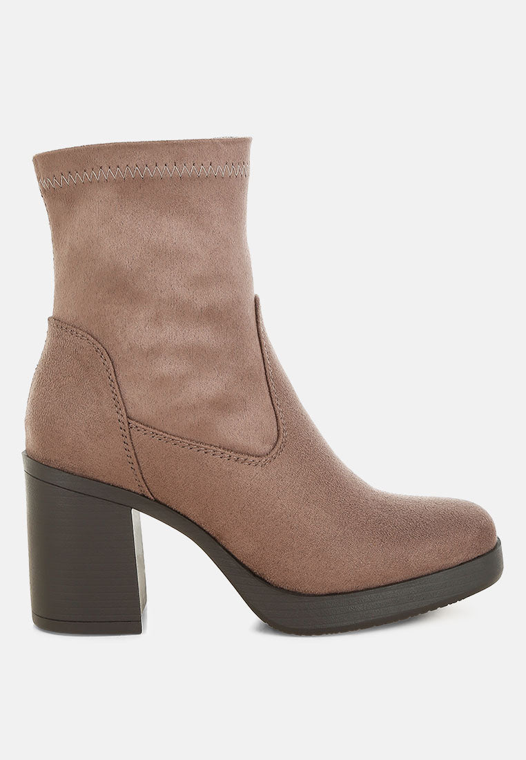 Brown ankle boot with block heel on a white background