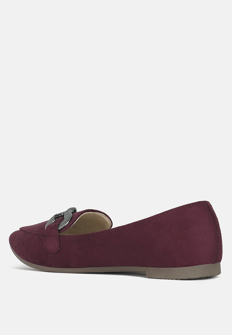 Burgundy loafer heel-side view with flexible rubber sole and horsebit strap