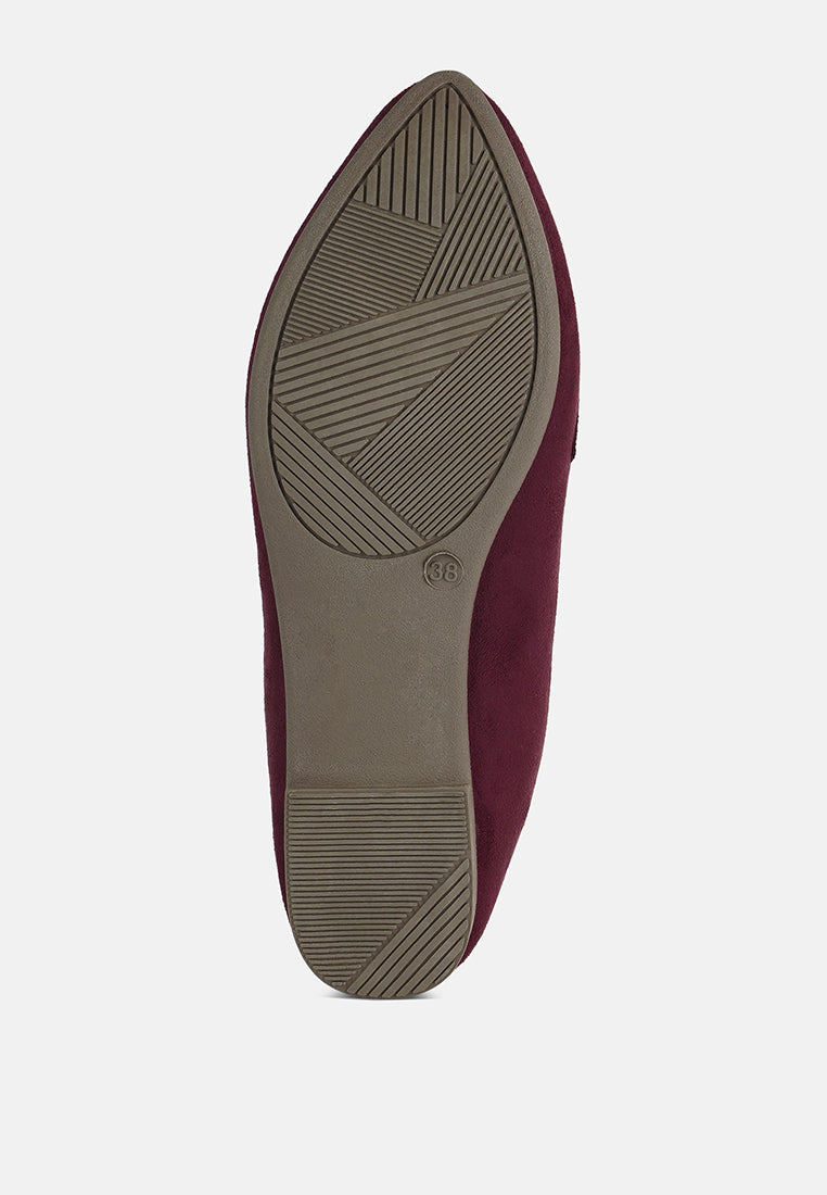 Burgundy suede loafer outsole view with textured rubber tread pattern