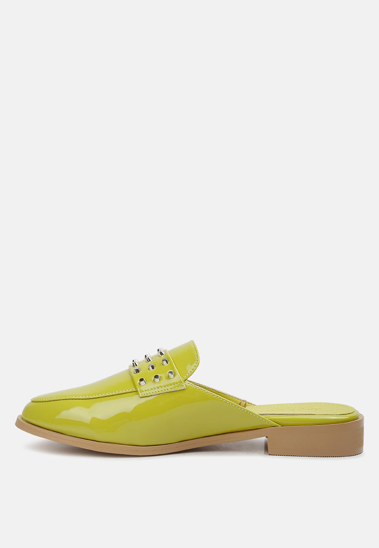 Yashta patent studded flat mules (lime green) profile view with square toe and flat sole.