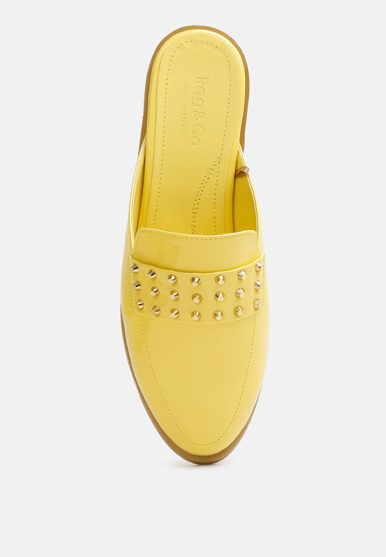Yellow mule insole view with studded band across the front