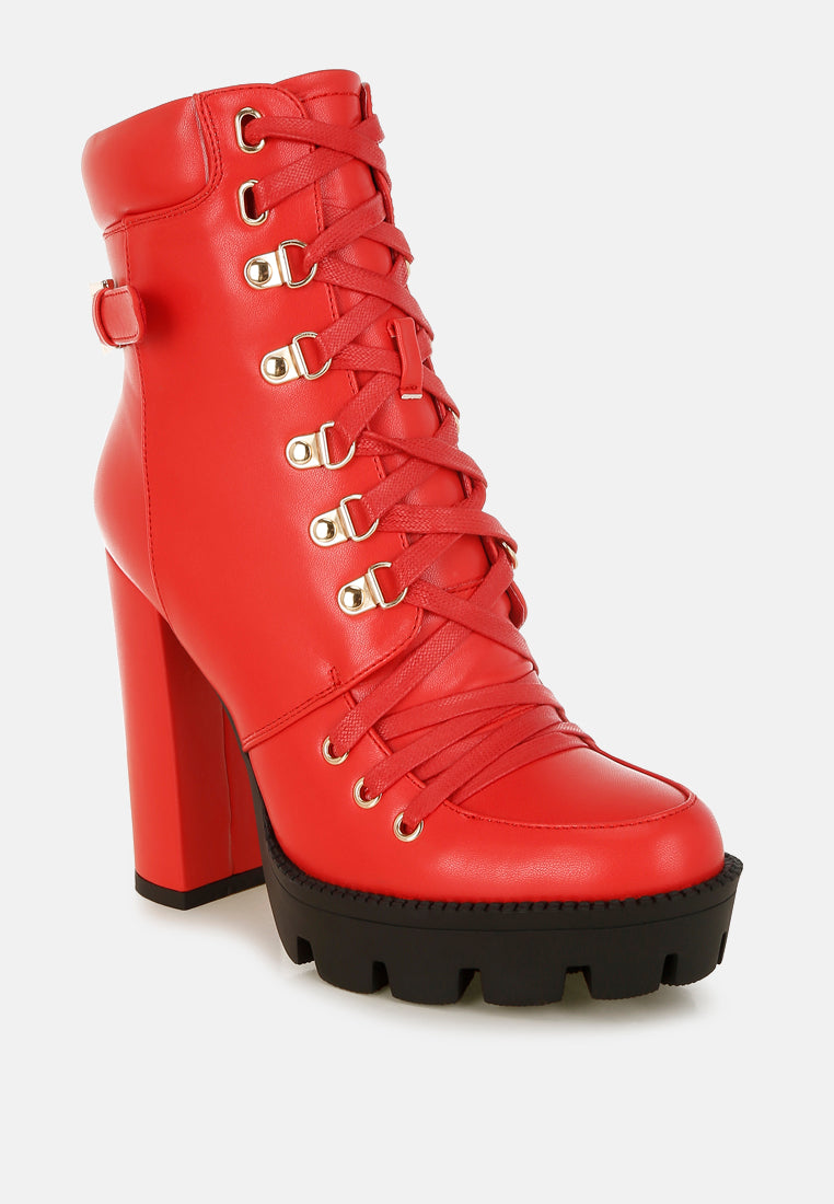 Red combat boot angled view with lace-up front and chunky lug platform sole