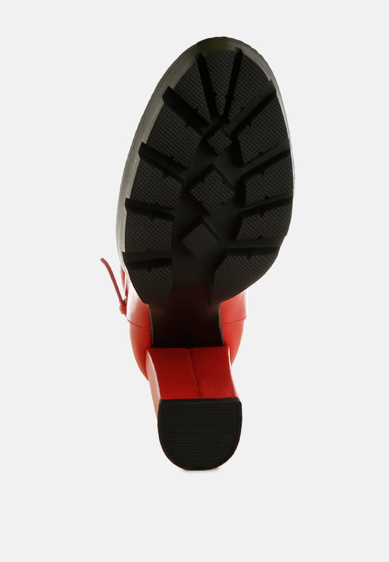 Red boot outsole with chunky tread and thick platform heel
