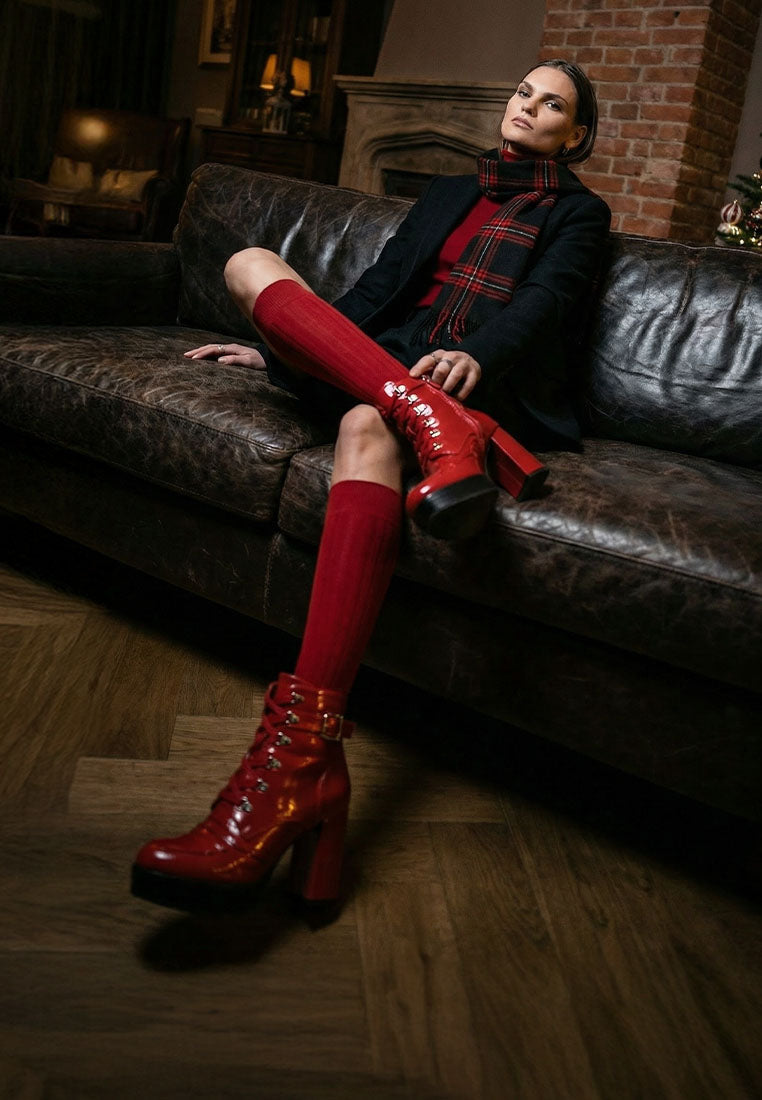 Red lace-up combat boots with chunky platform sole and block heel