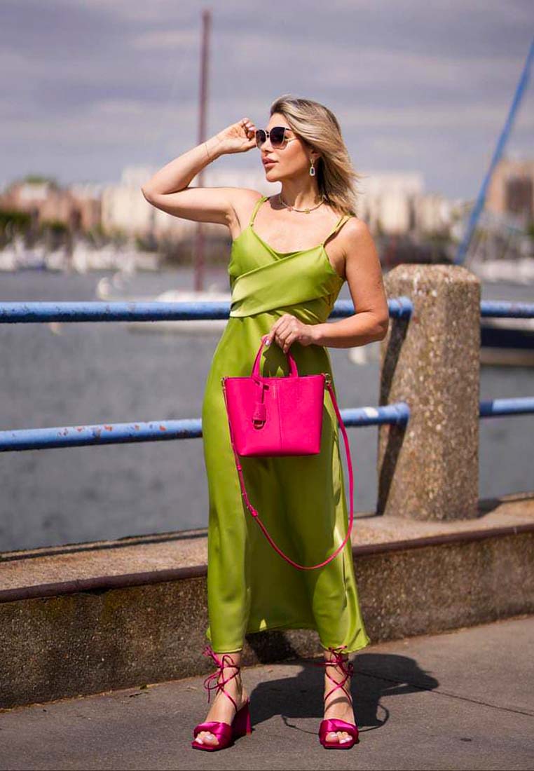 Pink satin block heel sandal on foot, thick twisted strap detail