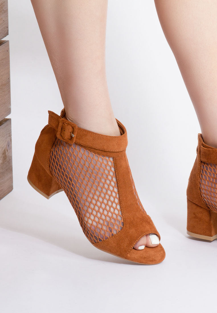 Brown open-toe shoes with mesh design on a white background