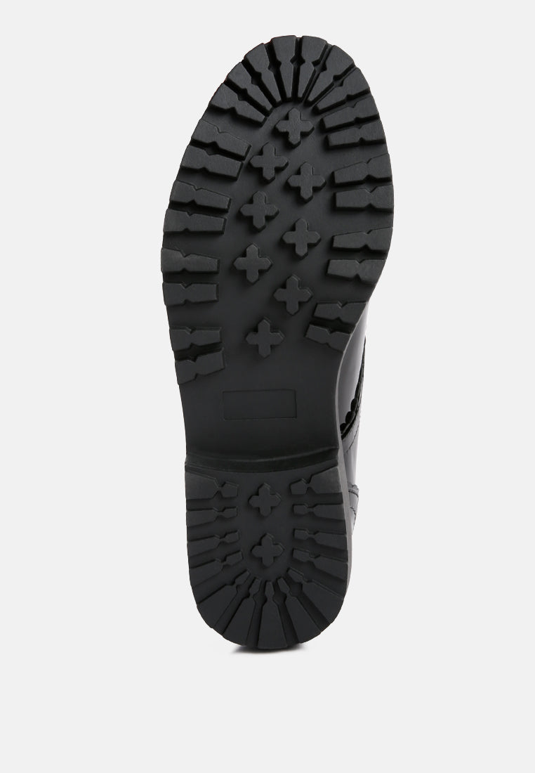 Black derby shoe outsole with rugged tread pattern