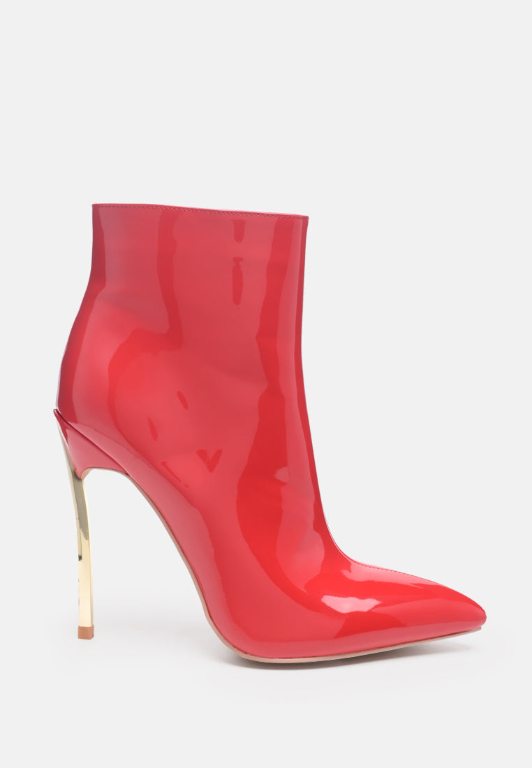 Red patent leather ankle boot with a high heel on a white background