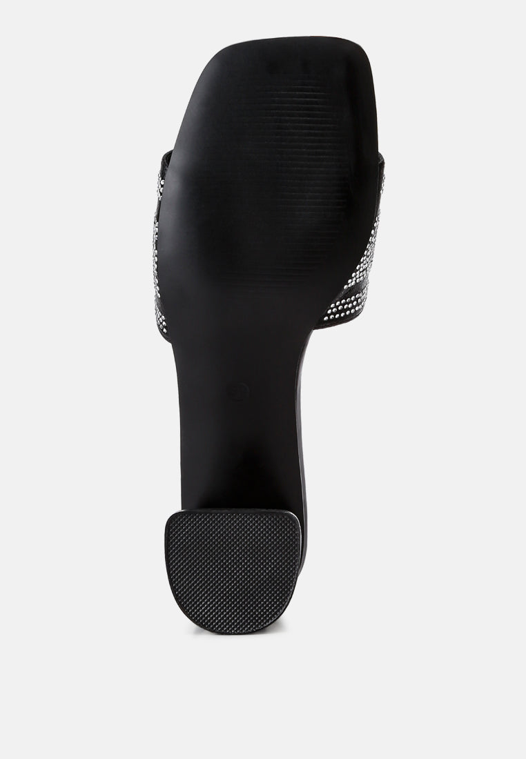 Studio 55 Black sandal outsole view with textured grip under block heel