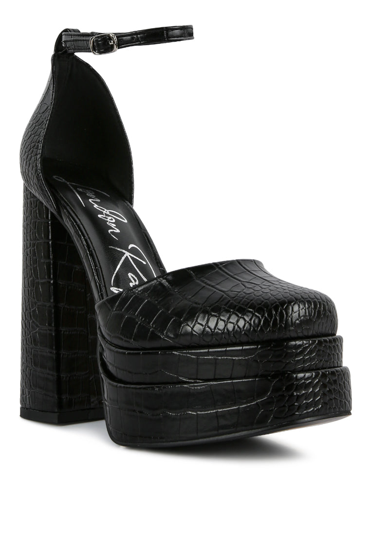 Black croc-textured platform mule sandal with tall block heel and ankle strap