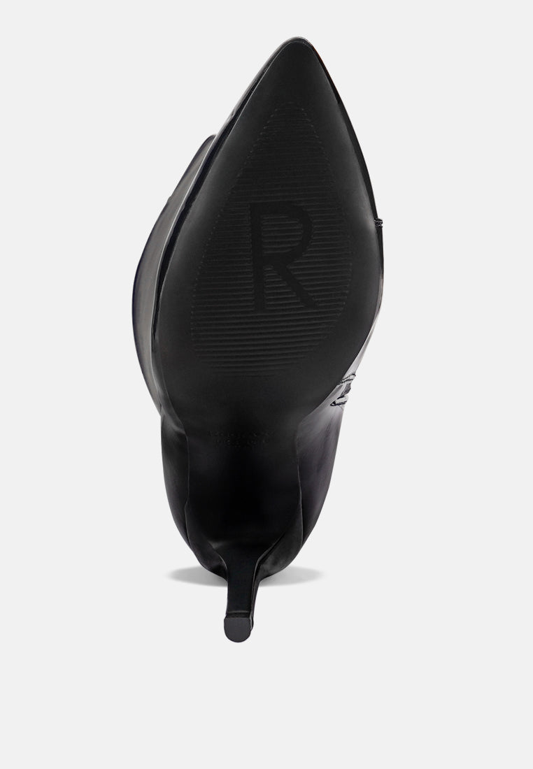 Black stiletto boot heel with embossed logo on the back sole.