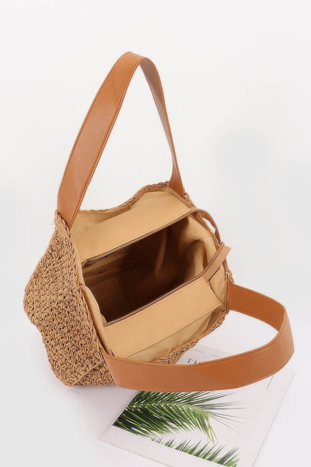 Khaki faux straw tote bag interior view with tan lining and shoulder strap