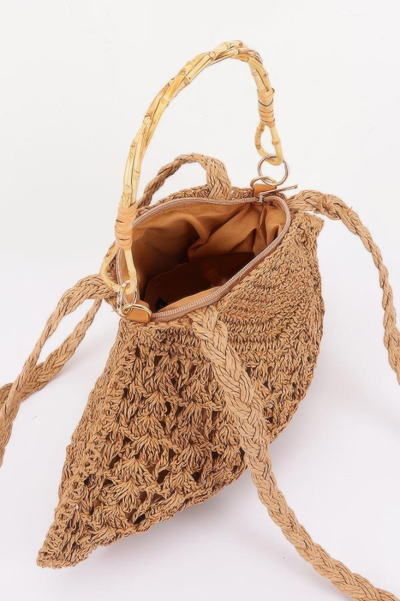 Faux straw bamboo handle bag interior view with zip pocket and woven pull-through handles