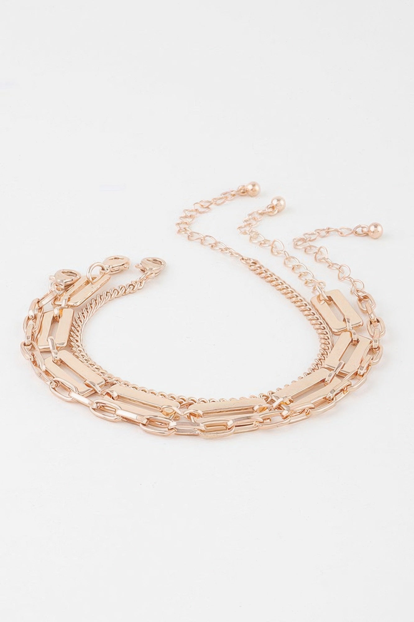 Triple plate curb link bracelet with lobster clasp, gold-tone curb chain layers