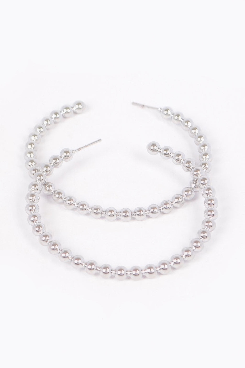 Silver metal hoop earrings with bead-like links and stud backs