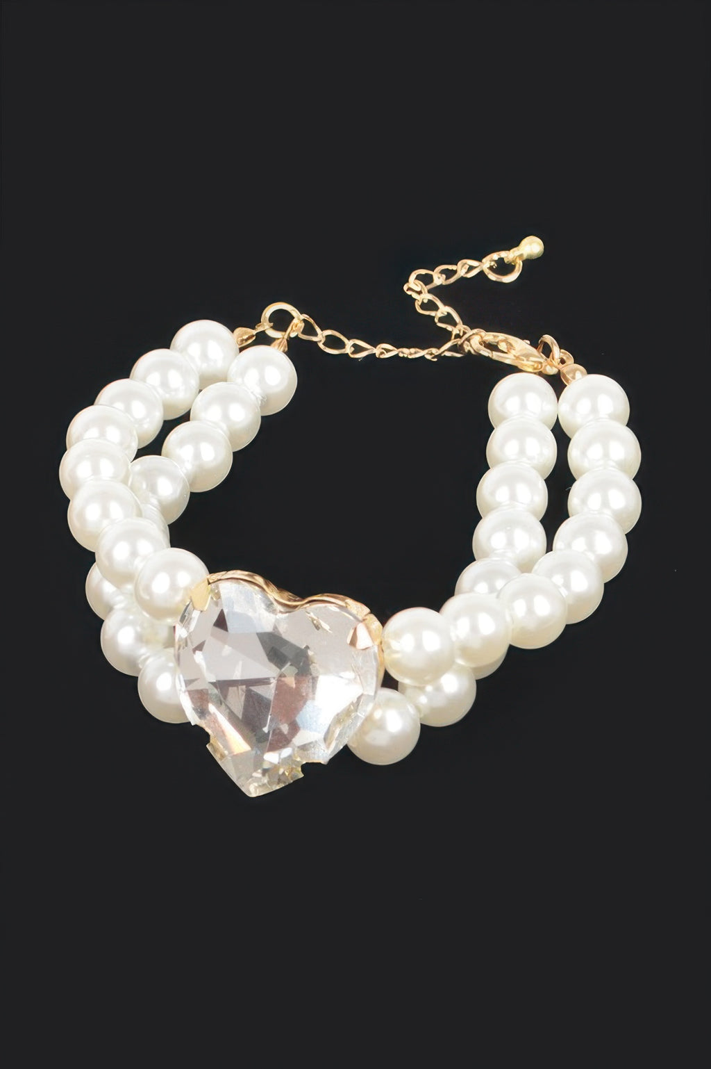 Cream pearl elastic bracelet with large crystal heart charm and gold chain clasp