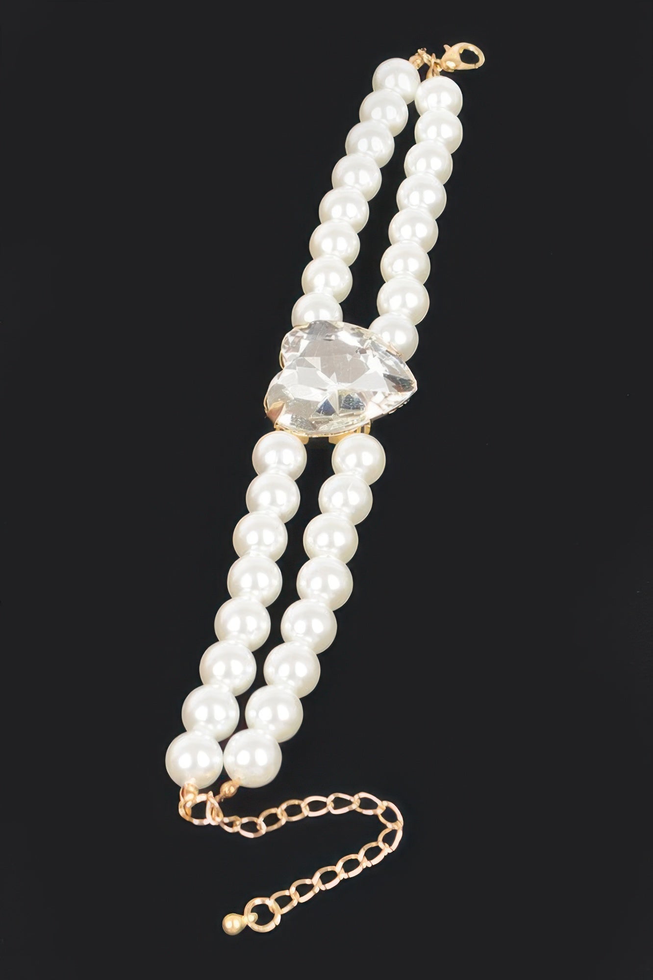 Cream faux pearl elastic bracelet with crystal heart centerpiece on bead strands