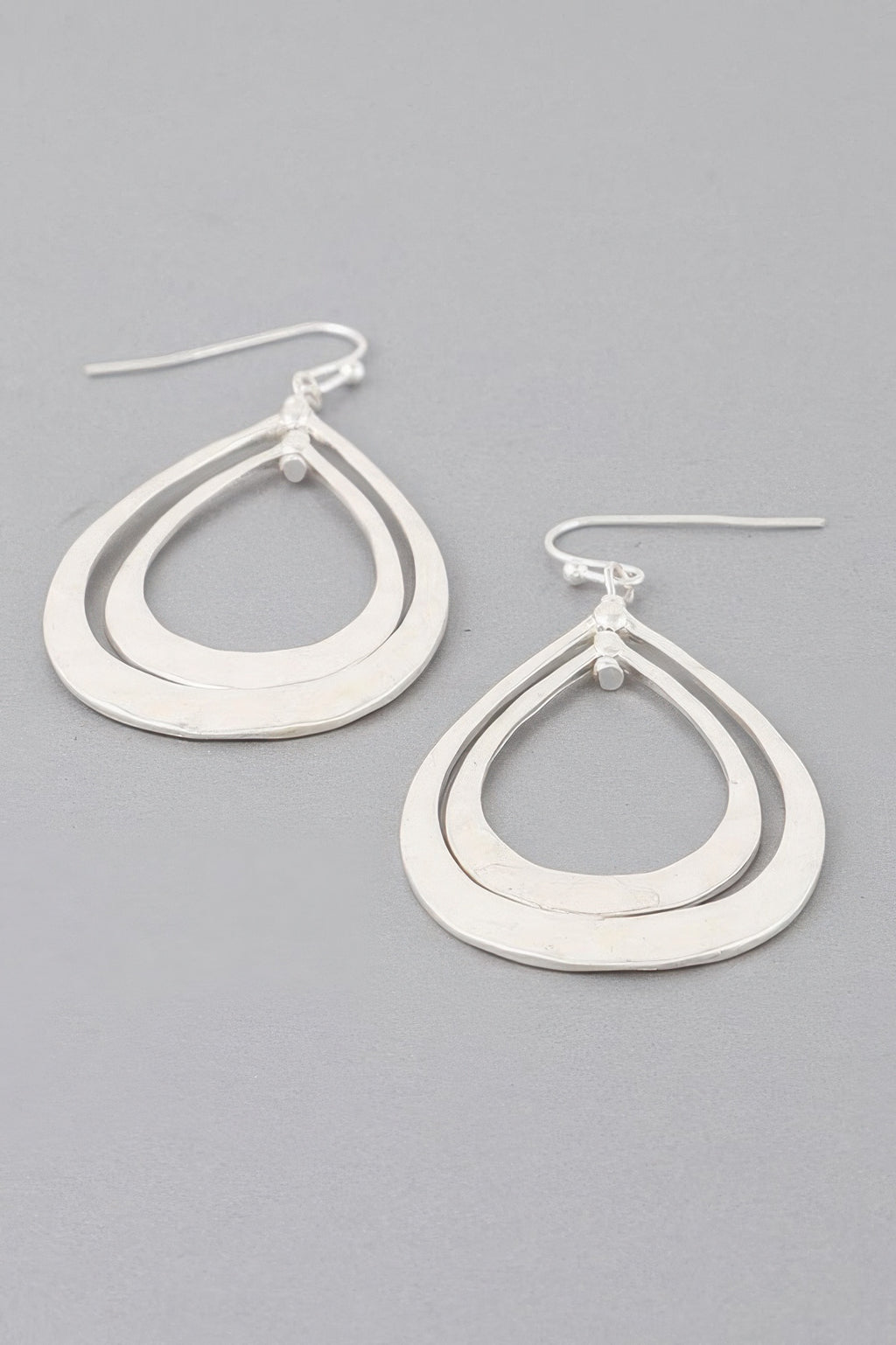 Silver hammered double teardrop earrings with stacked open teardrop rings and hooks