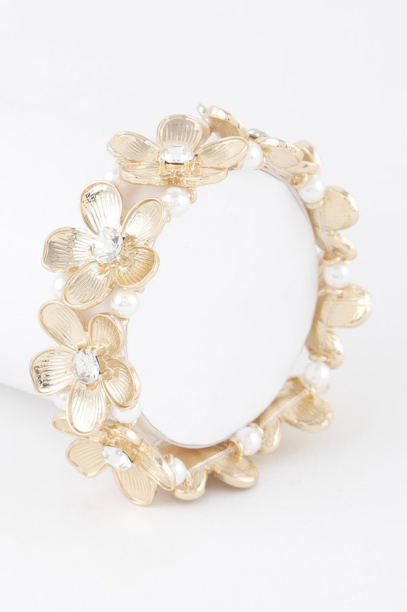 Gold-cream jeweled flower bracelet with rhinestone petal centers and bead links