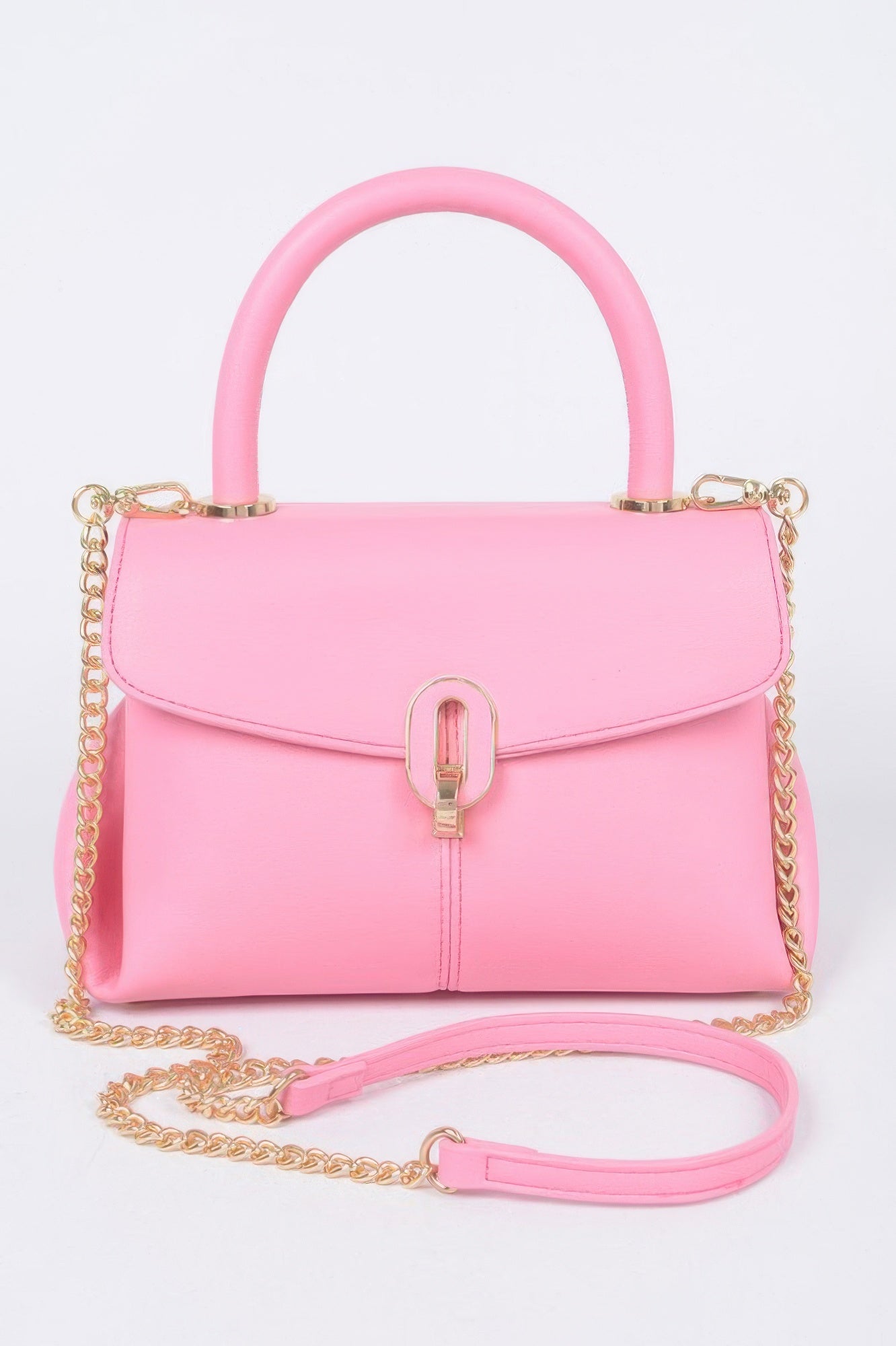 Pink faux leather top-handle bag with gold chain, front lock, and matching strap