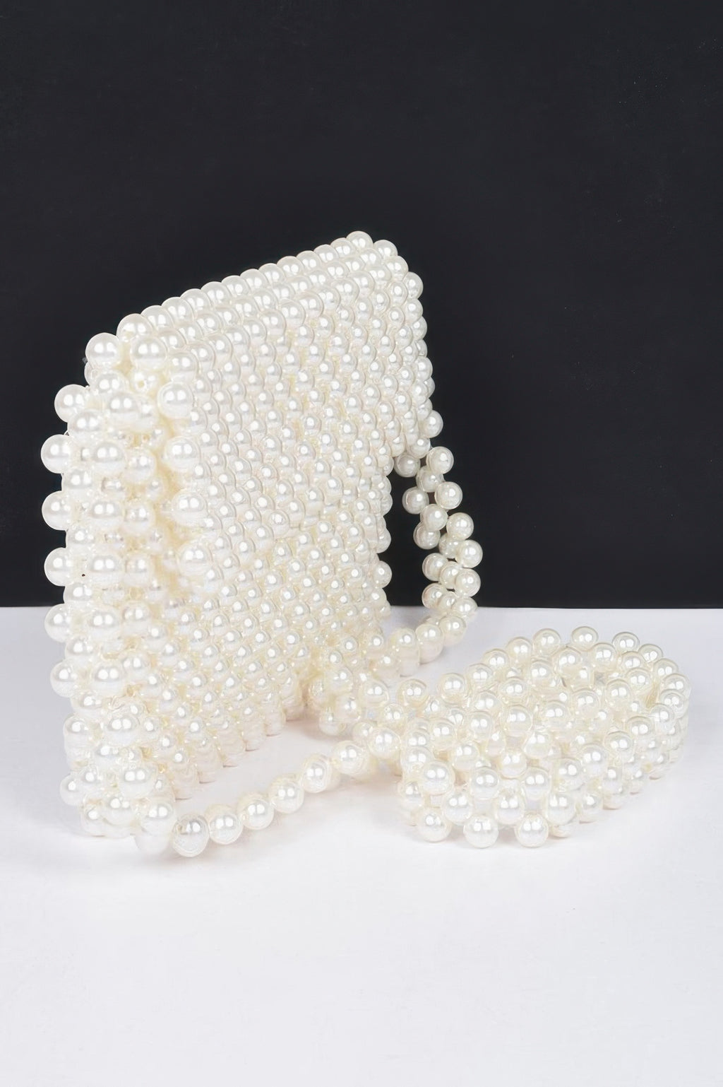 Cream faux pearl beaded crossbody bag with curved flap and side strap