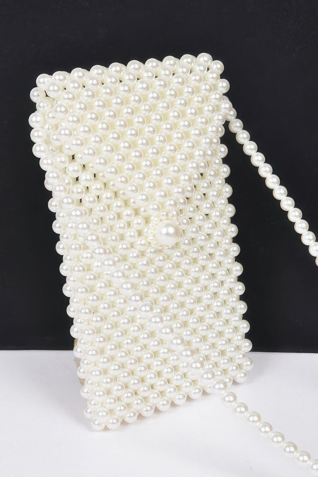 Cream faux pearl beaded crossbody bag, close-up textured pearl bead pattern