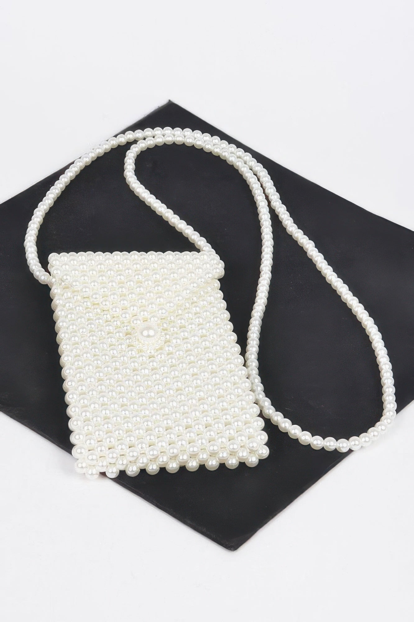 Cream faux pearl crossbody small bag with long shoulder strap and beaded top