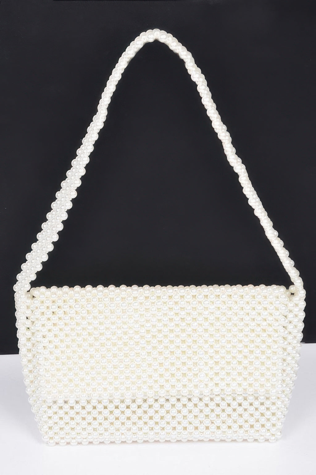 Cream faux pearl beaded shoulder bag with top handle, rectangular body