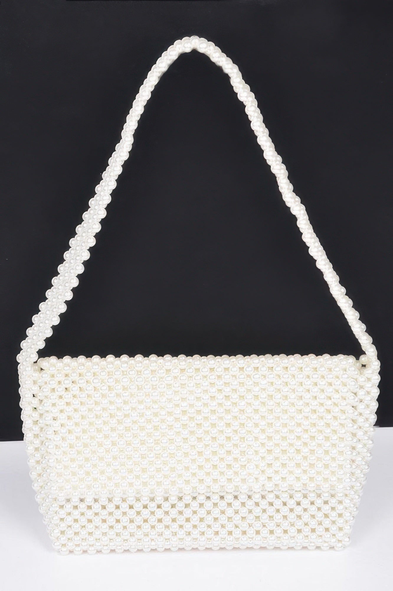 Cream faux pearl beaded shoulder bag with top handle, rectangular body