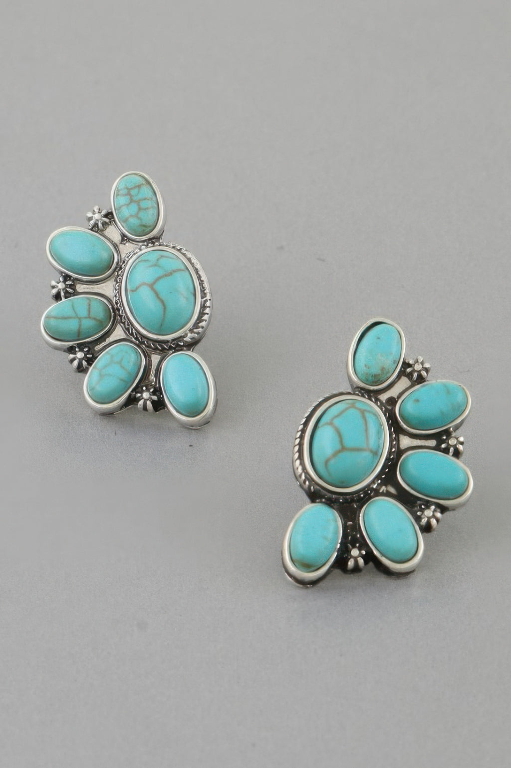 Turquoise half-flower stud earrings with scalloped silver-tone settings