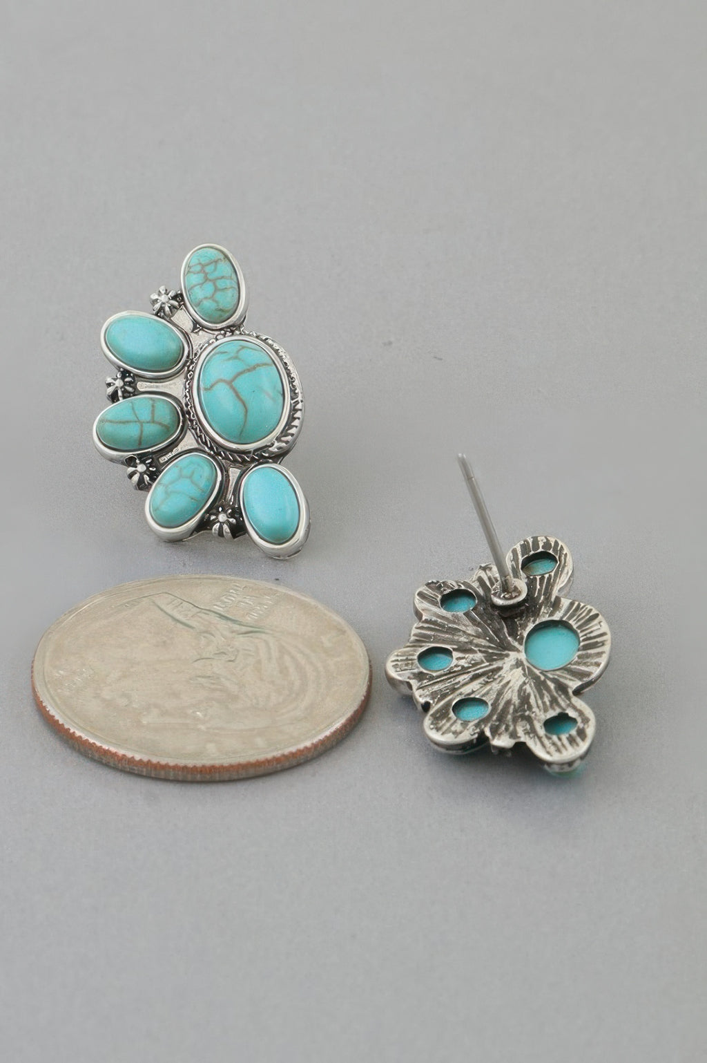 Turquoise half-flower stud earrings with detailed silver-tone filigree