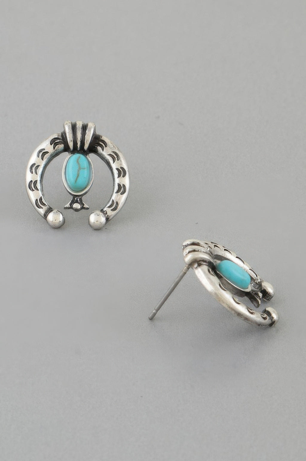 Antique horseshoe stud earring, silver-tone back with turquoise oval front