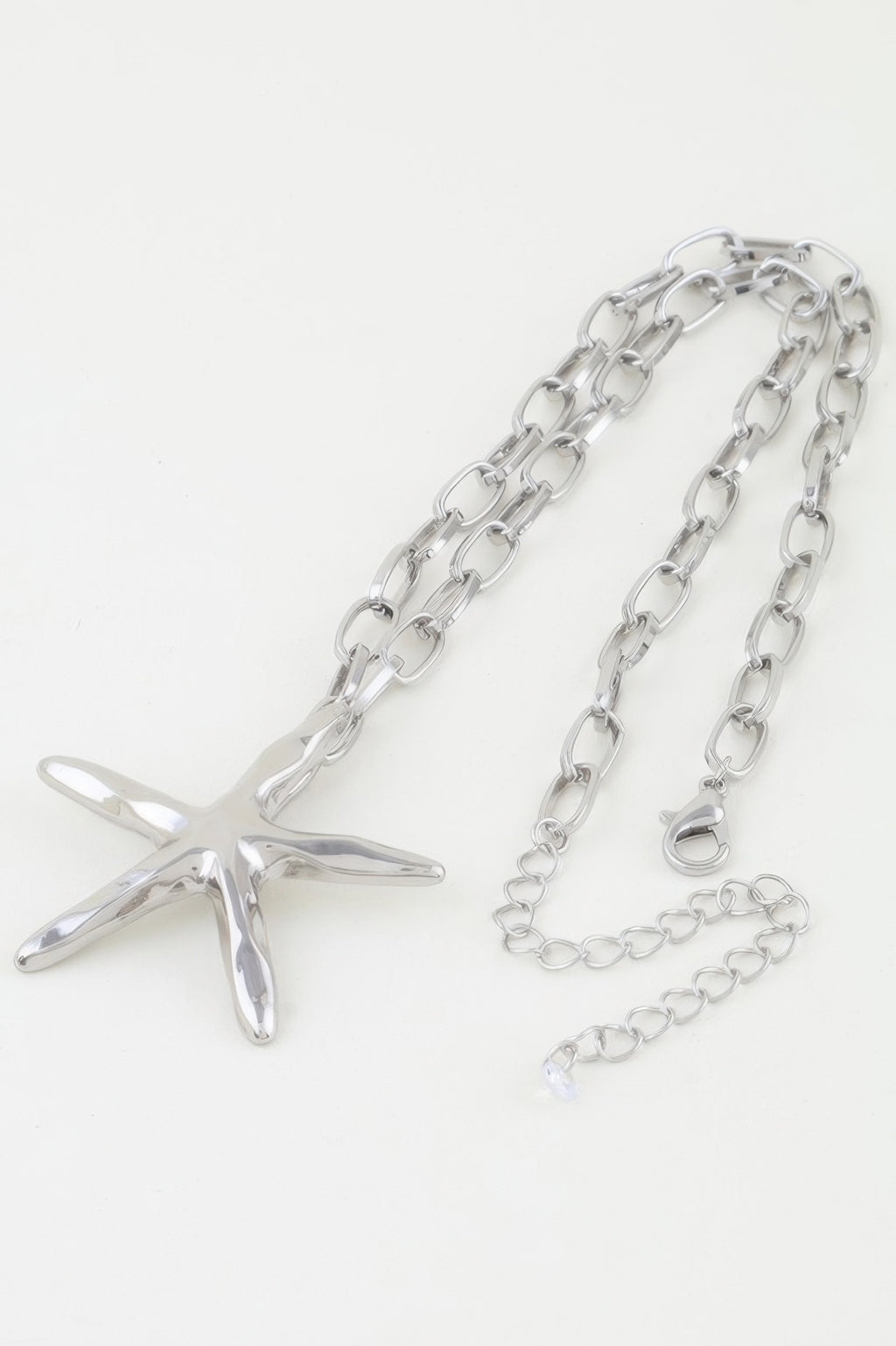 Silver starfish pendant on oval link chain necklace with extension links