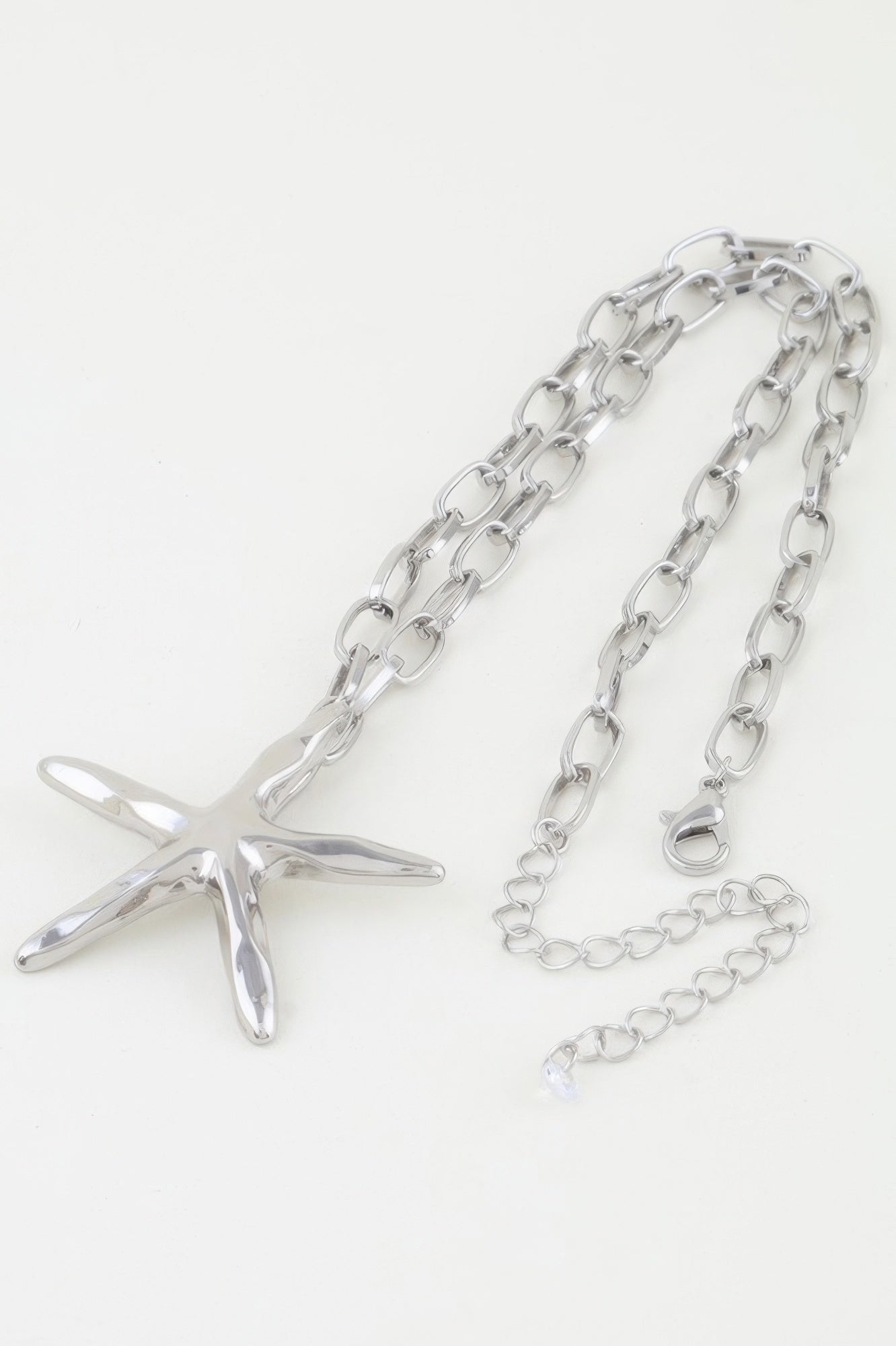 Silver starfish pendant on oval link chain necklace with extension links