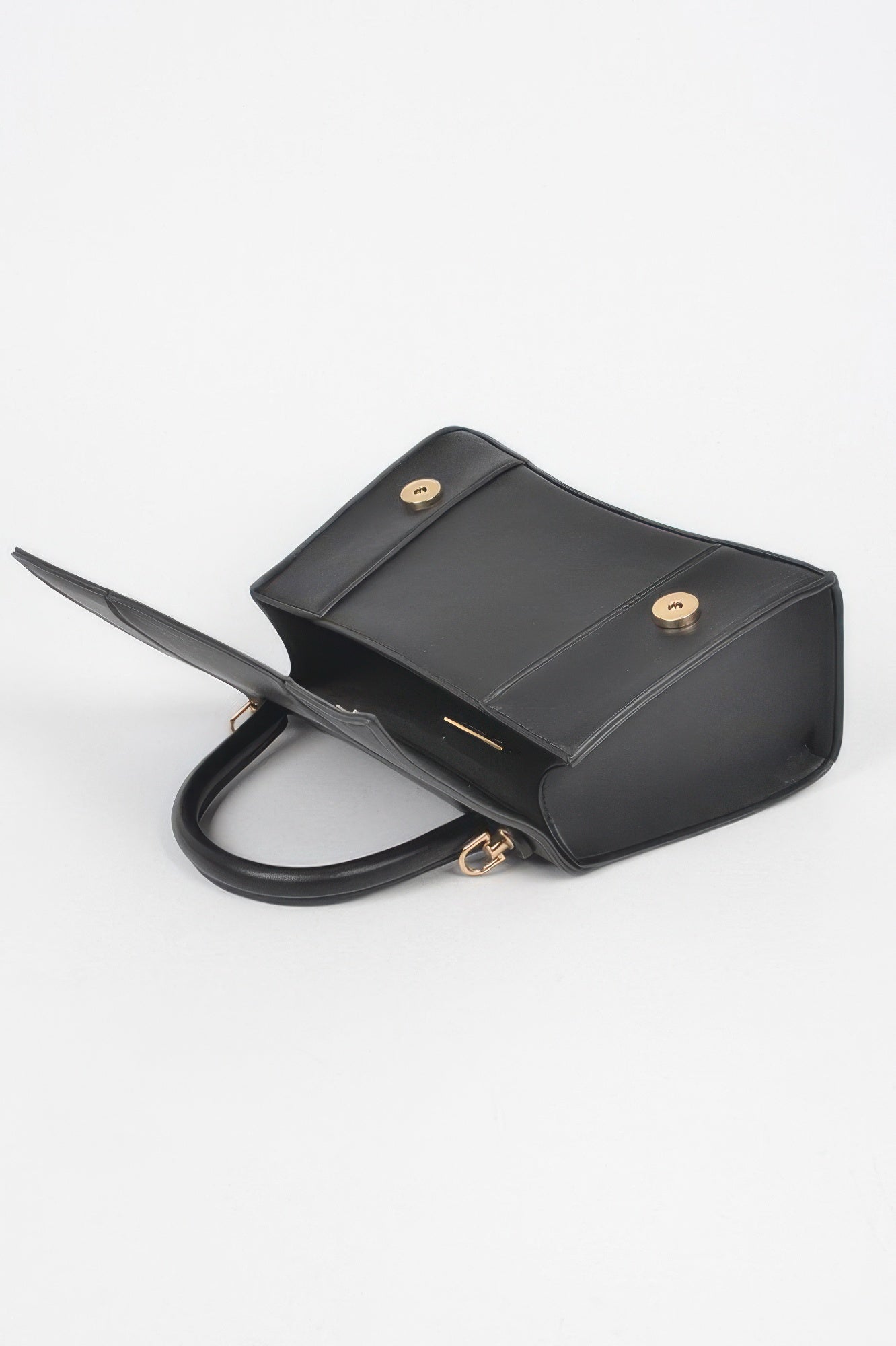 Black faux leather top-handle bag, open interior view with gold-tone hardware