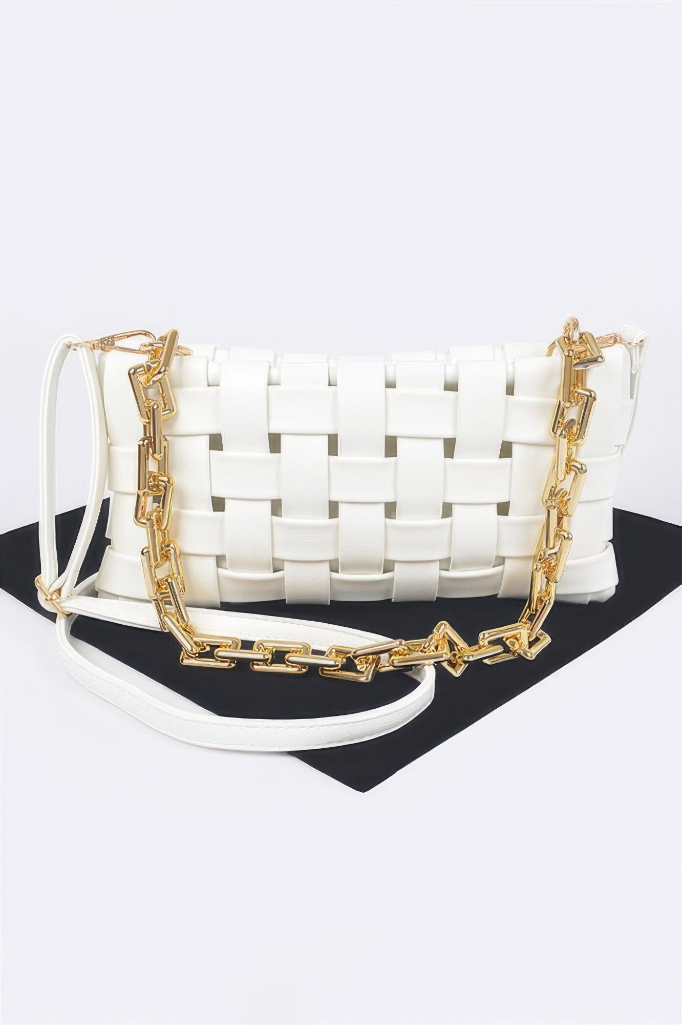 White braided chain crossbody bag with gold chain strap and woven detail