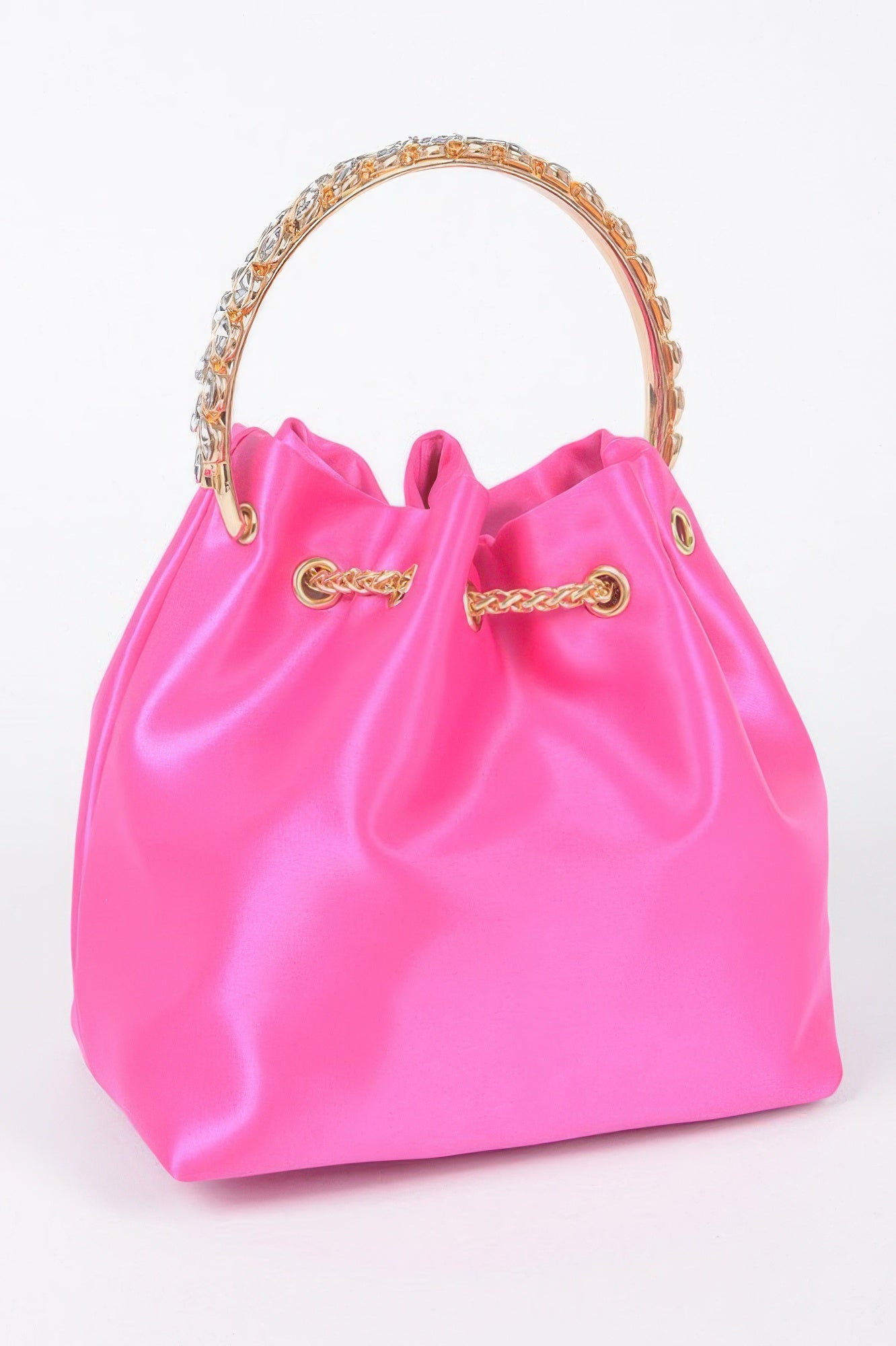Fuchsia satin bucket bag with rhinestone handle ring and gold chain crossbody